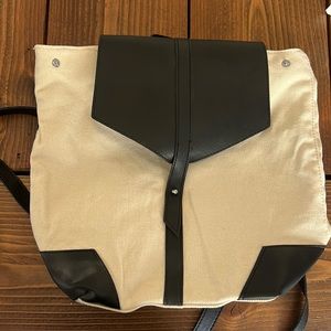 Black leather and cream canvas backpack bag